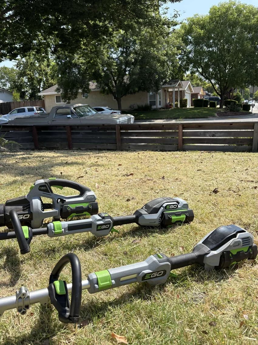 B&G landscaping tools laid out on a lawn